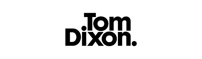 Logotipo de Tom Dixon, con el texto '.Tom' apilado sobre 'Dixon.' en negrita negra sobre fondo blanco.