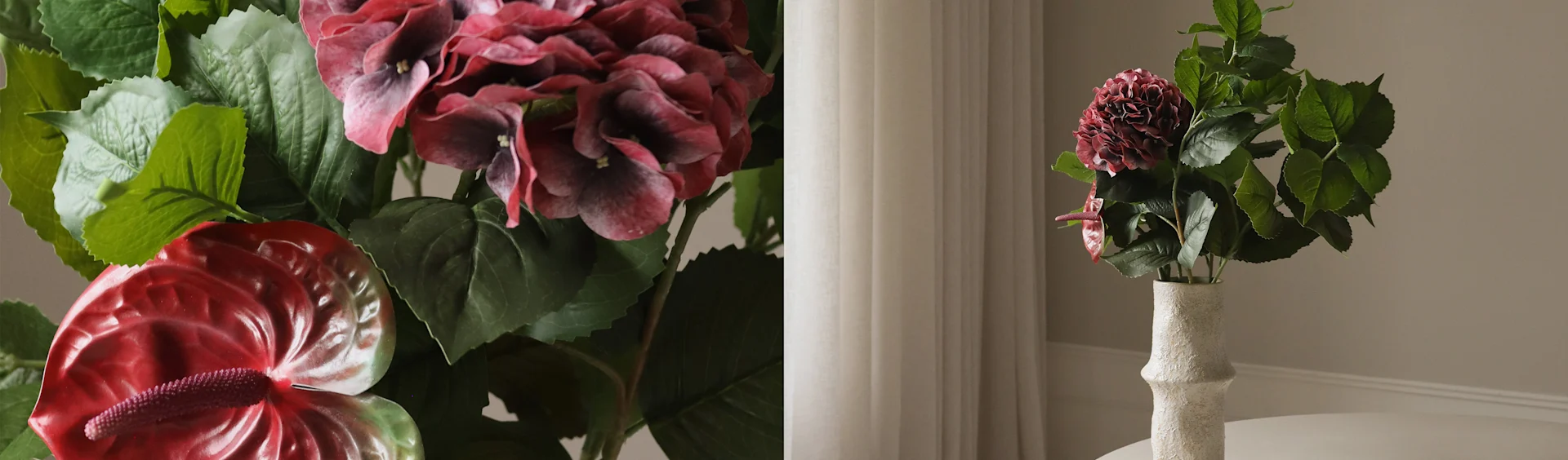 Hortensia roja oscura artificial y flores de anthurium rojo en un jarrón blanco texturizado.